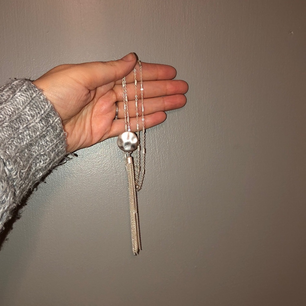 Long accent necklace with silver tassel